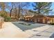 Community pool with protective covering and brick pool house at 3420 Ashwood Ln # 3420, Atlanta, GA 30341