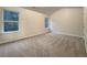 Spacious bedroom with neutral carpeting and large windows at 4444 Spring Mtn Ln, Powder Springs, GA 30127