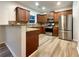 Modern kitchen with stainless steel appliances and granite countertops at 4444 Spring Mtn Ln, Powder Springs, GA 30127