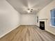 Spacious living room featuring a fireplace and hardwood floors at 4444 Spring Mtn Ln, Powder Springs, GA 30127