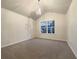 Bright main bedroom with carpeted floors and a chandelier at 4444 Spring Mtn Ln, Powder Springs, GA 30127