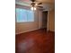 Bright bedroom features a ceiling fan, window with blinds and closet at 5581 Marbut Rd, Lithonia, GA 30058