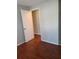 Brightly painted bedroom features hardwood floors and a doorway at 5581 Marbut Rd, Lithonia, GA 30058