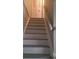 Stairway showcases freshly painted steps leading to the upper level, complemented by a white banister at 5581 Marbut Rd, Lithonia, GA 30058