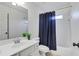 Clean bathroom with a shower/tub combo and updated vanity at 627 Village Manor Pl, Suwanee, GA 30024