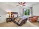 Bright bedroom with a comfortable bed and sitting area at 627 Village Manor Pl, Suwanee, GA 30024