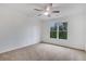 Simple bedroom with ceiling fan and large windows at 627 Village Manor Pl, Suwanee, GA 30024