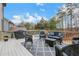 Relaxing deck with seating area and wooded views at 627 Village Manor Pl, Suwanee, GA 30024