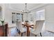 Elegant dining room with chandelier and hardwood floors at 627 Village Manor Pl, Suwanee, GA 30024