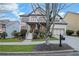 Two-story house with gray siding, shutters, and a covered porch at 627 Village Manor Pl, Suwanee, GA 30024