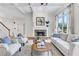 Living room with fireplace and hardwood floors at 627 Village Manor Pl, Suwanee, GA 30024