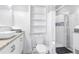 Modern bathroom with a walk-in shower, granite countertop, and built-in shelving at 2147 Cascade Sw Rd, Atlanta, GA 30311