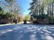 Picturesque entrance of 'Covered Bridge' community with lush landscaping at 2249 Runnymead Se Rdg, Marietta, GA 30067