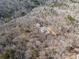 Panoramic aerial shot of a house secluded within a lush forest, showcasing its tranquil setting at 255 Marks Way, Canton, GA 30115
