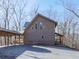 A-frame home with large windows and wood siding at 255 Marks Way, Canton, GA 30115