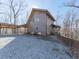Charming home exterior with unique architecture, gravel driveway, and carport at 255 Marks Way, Canton, GA 30115