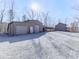 Exterior view showing a house, garage, and long driveway at 255 Marks Way, Canton, GA 30115