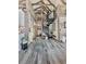 Hallway with light wood walls, spiral staircase to second level, and grey wood flooring at 255 Marks Way, Canton, GA 30115