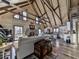 Stunning living room featuring wood-paneled walls, vaulted ceilings, and a stone fireplace at 255 Marks Way, Canton, GA 30115