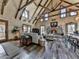 Cozy living room with wood-paneled walls, stone fireplace, and lots of natural light at 255 Marks Way, Canton, GA 30115