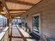 Comfortable covered porch with wooden floors and decor, an ideal space for relaxation at 255 Marks Way, Canton, GA 30115