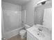 Cozy bathroom featuring a tub, shower and single sink vanity at 2756 Palmview Sw Ct, Atlanta, GA 30331