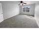 Spacious bedroom with neutral carpet and walls with a large window offering natural light at 2756 Palmview Sw Ct, Atlanta, GA 30331