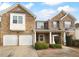 Two story brick home with a two car garage and manicured lawn at 2756 Palmview Sw Ct, Atlanta, GA 30331