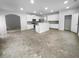 Open concept kitchen featuring an island with modern appliances and tiled flooring at 2756 Palmview Sw Ct, Atlanta, GA 30331