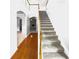 Staircase with hardwood floors and carpeted steps, showcasing the transition to the upper level at 2756 Palmview Sw Ct, Atlanta, GA 30331