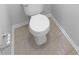 Clean bathroom featuring a white toilet, tiled flooring and modern fixtures at 2756 Palmview Sw Ct, Atlanta, GA 30331