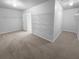 Spacious walk-in closet with wire shelving and carpeting at 2756 Palmview Sw Ct, Atlanta, GA 30331