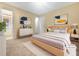 Virtually staged bedroom with light wood furniture and carpet at 1089 Brittwood Pl, Norcross, GA 30093
