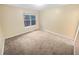 Bedroom with neutral carpeting and a large window at 1089 Brittwood Pl, Norcross, GA 30093