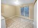 Simple dining area with tile flooring and large window at 1089 Brittwood Pl, Norcross, GA 30093