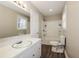 Clean bathroom with a white vanity, tub, and shower at 1381 High Meadow Dr, Stone Mountain, GA 30083