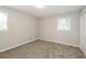 Bright bedroom featuring neutral walls and carpet at 1381 High Meadow Dr, Stone Mountain, GA 30083