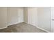 Spacious bedroom with ample closet space and neutral carpeting at 1381 High Meadow Dr, Stone Mountain, GA 30083