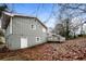 Side view of house with deck and yard at 1381 High Meadow Dr, Stone Mountain, GA 30083
