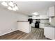 Modern kitchen with white cabinets, granite countertops, and black appliances at 1381 High Meadow Dr, Stone Mountain, GA 30083