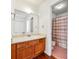 Bathroom with a vanity, a large mirror, and a shower area with a striped curtain at 1625 Conley Rd # 270, Conley, GA 30288