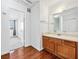 Bathroom featuring a wood vanity with a large mirror and a doorway view into the bedroom at 1625 Conley Rd # 270, Conley, GA 30288