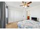 Bright bedroom featuring a ceiling fan, neutral walls, and multiple closets for ample storage at 1625 Conley Rd # 270, Conley, GA 30288