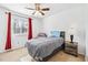 Cozy bedroom featuring a ceiling fan, neutral walls, and a window providing natural light at 1625 Conley Rd # 270, Conley, GA 30288