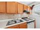 Kitchen featuring tile backsplash and stove at 1625 Conley Rd # 270, Conley, GA 30288