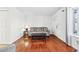 Comfortable living room with hardwood floors, sofa, and an accent chair at 1625 Conley Rd # 270, Conley, GA 30288