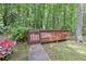 Backyard wooden deck and stone path offer a private outdoor space at 4259 Arbor Club Dr, Marietta, GA 30066