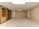 This finished basement features built-in wooden bookcases and neutral walls at 4259 Arbor Club Dr, Marietta, GA 30066