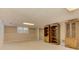 This finished basement includes built-in bookcases, carpeted floors, and natural light at 4259 Arbor Club Dr, Marietta, GA 30066