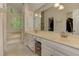 Bright bathroom features a double vanity, tub, and large windows at 4259 Arbor Club Dr, Marietta, GA 30066